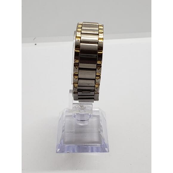 Women\'s Timex dress watch. Square white iridescent face. Large gold bevel